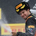 Sergio Perez (MEX) Force India celebrates with champagne on the podium at Formula One World Championship, Rd15, Russian Grand Prix, Race, Sochi Autodrom, Sochi, Krasnodar Krai, Russia, Sunday 11 October 2015. © Sutton Motorsport Images