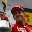 Sebastian Vettel (GER) Ferrari celebrates with the trophy on the podium at Formula One World Championship, Rd15, Russian Grand Prix, Race, Sochi Autodrom, Sochi, Krasnodar Krai, Russia, Sunday 11 October 2015. © Sutton Motorsport Images