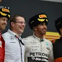 (L to R): Sebastian Vettel (GER) Ferrari, Andy Cowell (GBR) Managing Director, race winner Lewis Hamilton (GBR) Mercedes AMG F1 and Sergio Perez (MEX) Force India celebrate on the podium at Formula One World Championship, Rd15, Russian Grand Prix, Race, Sochi Autodrom, Sochi, Krasnodar Krai, Russia, Sunday 11 October 2015. © Sutton Motorsport Images