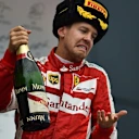 Sebastian Vettel (GER) Ferrari celebrates with the champagne on the podium at Formula One World Championship, Rd15, Russian Grand Prix, Race, Sochi Autodrom, Sochi, Krasnodar Krai, Russia, Sunday 11 October 2015. © Sutton Motorsport Images