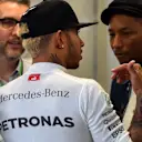 Lewis Hamilton (GBR) Mercedes AMG F1 and Pharrell Williams (USA) in the Mercedes AMG F1 garage at Formula One World Championship, Rd13, Singapore Grand Prix, Practice, Marina Bay Street Circuit, Singapore, Friday 18 September 2015. © Sutton Motorsport Images