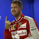 Pole sitter Sebastian Vettel (GER) Ferrari celebrates in parc ferme at Formula One World Championship, Rd13, Singapore Grand Prix, Qualifying, Marina Bay Street Circuit, Singapore, Saturday 19  September 2015. © Sutton Motorsport Images
