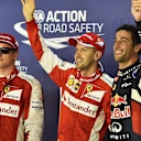 (L to R): Kimi Raikkonen (FIN) Ferrari, Sebastian Vettel (GER) Ferrari and Daniel Ricciardo (AUS) Red Bull Racing celebrate in parc ferme at Formula One World Championship, Rd13, Singapore Grand Prix, Qualifying, Marina Bay Street Circuit, Singapore, Saturday 19 September 2015. © Sutton Motorsport Images