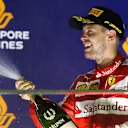 Race winner Sebastian Vettel (GER) Ferrari celebrates on the podium with champagne at Formula One World Championship, Rd13, Singapore Grand Prix, Race, Marina Bay Street Circuit, Singapore, Sunday 20 September 2015. © Sutton Motorsport Images