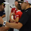 Fernando Alonso (ESP) McLaren and Pastor Maldonado (VEN) Lotus on the drivers parade at Formula One World Championship, Rd13, Singapore Grand Prix, Race, Marina Bay Street Circuit, Singapore, Sunday 20 September 2015. © Sutton Motorsport Images