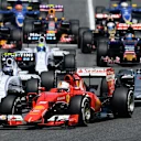 Sebastian Vettel (GER) Ferrari SF15-T and Lewis Hamilton (GBR) Mercedes AMG F1 W06 battle at the start at Formula One World Championship, Rd5, Spanish Grand Prix Race, Barcelona, Spain, Sunday 10 May 2015. © Sutton Motorsport Images