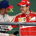 Race winner and new World Champion Lewis Hamilton (GBR) Mercedes AMG F1 celebrates on the podium with Sebastian Vettel (GER) Ferrari at Formula One World Championship, Rd16, United States  Grand Prix, Race, Austin, Texas, USA, Sunday 25 October 2015. © Sutton Motorsport Images