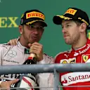 Sebastian Vettel (GER) Ferrari and race winner Lewis Hamilton (GBR) Mercedes AMG F1 celebrate on the podium with champagne at Formula One World Championship, Rd16, United States  Grand Prix, Race, Austin, Texas, USA, Sunday 25 October 2015. © Sutton Motorsport Images