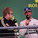 Elton John (GBR) and Lewis Hamilton (GBR) Mercedes AMG F1 on the podium at Formula One World Championship, Rd16, United States  Grand Prix, Race, Austin, Texas, USA, Sunday 25 October 2015. © Sutton Motorsport Images