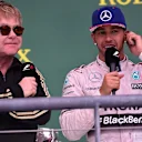 Elton John (GBR) and Lewis Hamilton (GBR) Mercedes AMG F1 on the podium at Formula One World Championship, Rd16, United States  Grand Prix, Race, Austin, Texas, USA, Sunday 25 October 2015. © Sutton Motorsport Images