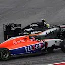 Alexander Rossi (USA) Marussia and Sergio Perez (MEX) Force India VJM08 battle at Formula One World Championship, Rd16, United States  Grand Prix, Race, Austin, Texas, USA, Sunday 25 October 2015. © Sutton Motorsport Images