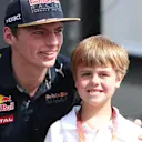 Max Verstappen (NED) Red Bull Racing and young fan at Formula One World Championship, Rd21, Abu Dhabi Grand Prix, Practice, Yas Marina Circuit, Abu Dhabi, UAE, Friday 25 November 2016. © Sutton Images