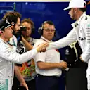 Lewis Hamilton (GBR) Mercedes AMG F1 and Nico Rosberg (GER) Mercedes AMG F1 celebrate and shakehands in parc ferme at Formula One World Championship, Rd21, Abu Dhabi Grand Prix, Qualifying, Yas Marina Circuit, Abu Dhabi, UAE, Saturday 26 November 2016. © Sutton Images