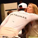 Vivian Rosberg (GER) wife of Nico Rosberg (GER) Mercedes AMG F1 is congratulated by Lewis Hamilton (GBR) Mercedes AMG F1 at the Press Conference at Formula One World Championship, Rd21, Abu Dhabi Grand Prix, Race, Yas Marina Circuit, Abu Dhabi, UAE, Sunday 27 November 2016. © Sutton Images