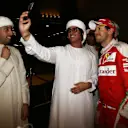 Sebastian Vettel (GER) Ferrari poses for a selfie photo with the fans at Formula One World Championship, Rd21, Abu Dhabi Grand Prix, Race, Yas Marina Circuit, Abu Dhabi, UAE, Sunday 27 November 2016. © Sutton Images