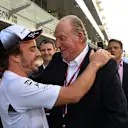 Fernando Alonso (ESP) McLaren and Juan Carlos of Spain (ESP) at Formula One World Championship, Rd21, Abu Dhabi Grand Prix, Race, Yas Marina Circuit, Abu Dhabi, UAE, Sunday 27 November 2016. © Sutton Images