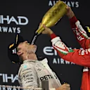 Nico Rosberg (GER) Mercedes AMG F1 and Sebastian Vettel (GER) Ferrari celebrate on the podium at Formula One World Championship, Rd21, Abu Dhabi Grand Prix, Race, Yas Marina Circuit, Abu Dhabi, UAE, Sunday 27 November 2016. © Sutton Images