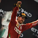 Sebastian Vettel (GER) Ferrari celebrates on the podium with the trophy at Formula One World Championship, Rd21, Abu Dhabi Grand Prix, Race, Yas Marina Circuit, Abu Dhabi, UAE, Sunday 27 November 2016. © Sutton Images