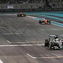 Race winner Lewis Hamilton (GBR) Mercedes-Benz F1 W07 Hybrid takes the chequeredflag followed by Nico Rosberg (GER) Mercedes-Benz F1 W07 Hybrid and Sebastian Vettel (GER) Ferrari SF16-H at Formula One World Championship, Rd21, Abu Dhabi Grand Prix, Race, Yas Marina Circuit, Abu Dhabi, UAE, Sunday 27 November 2016. © Sutton Images