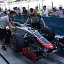 Haas mechanics with Haas VF-16 in pit lane at Formula One World Championship, Rd21, Abu Dhabi Grand Prix, Preparations, Yas Marina Circuit, Abu Dhabi, UAE, Thursday 24 November 2016. © Sutton Images