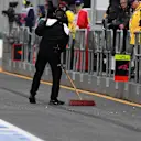 Mechanic sweeps pit lane at Formula One World Championship, Rd1, Australian Grand Prix, Qualifying, Albert Park, Melbourne, Australia, Saturday 19 March 2016. © Sutton Motorsport Images