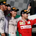 (L to R): Lewis Hamilton (GBR) Mercedes AMG F1, Race winner Nico Rosberg (GER) Mercedes AMG F1 and Sebastian Vettel (GER) Ferrari celebrate on the podium at Formula One World Championship, Rd1, Australian Grand Prix, Race, Albert Park, Melbourne, Australia, Sunday 20 March 2016. © Sutton Motorsport Images