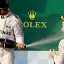 Lewis Hamilton (GBR) Mercedes AMG F1 and Nico Rosberg (GER) Mercedes AMG F1 celebrate on the podium with the champagne at Formula One World Championship, Rd1, Australian Grand Prix, Race, Albert Park, Melbourne, Australia, Sunday 20 March 2016. © Sutton Motorsport Images