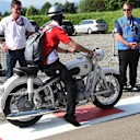 Sebastian Vettel (GER) Ferrari arrives at the track on a vintage BMW motorbike at Formula One World Championship, Rd9, Austrian Grand Prix, Qualifying, Spielberg, Austria, Saturday 2 July 2016. © Sutton Images