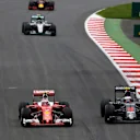 Kimi Raikkonen (FIN) Ferrari SF16-H passes Jenson Button (GBR) McLaren MP4-31 at Formula One World Championship, Rd9, Austrian Grand Prix, Race, Spielberg, Austria, Sunday 3 July 2016. © Sutton Images