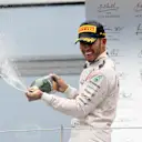 Race winner Lewis Hamilton (GBR) Mercedes AMG F1 celebrates on the podium with the champagne at Formula One World Championship, Rd9, Austrian Grand Prix, Race, Spielberg, Austria, Sunday 3 July 2016. © Sutton Images