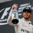 Race winner Lewis Hamilton (GBR) Mercedes AMG F1 celebrates on the podium with the champagne at Formula One World Championship, Rd9, Austrian Grand Prix, Race, Spielberg, Austria, Sunday 3 July 2016. © Sutton Images