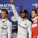 (L to R): Nico Rosberg (GER) Mercedes AMG F1, pole sitter Lewis Hamilton (GBR) Mercedes AMG F1 and Sebastian Vettel (GER) Ferrari celebrate in parc ferme at Formula One World Championship, Rd2, Bahrain Grand Prix Qualifying, Bahrain International Circuit, Sakhir, Bahrain, Saturday 2 April 2016. © Sutton Motorsport Images