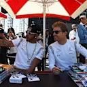 Lewis Hamilton (GBR) Mercedes AMG F1 and Nico Rosberg (GER) Mercedes AMG F1 pose for a selfie at the autograph session at Formula One World Championship, Rd2, Bahrain Grand Prix Qualifying, Bahrain International Circuit, Sakhir, Bahrain, Saturday 2 April 2016. © Sutton Motorsport Images