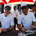 Stoffel Vandoorne (BEL) McLaren and Jenson Button (GBR) McLaren at the autograph session at Formula One World Championship, Rd2, Bahrain Grand Prix Qualifying, Bahrain International Circuit, Sakhir, Bahrain, Saturday 2 April 2016. © Sutton Motorsport Images