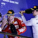 Race winner Nico Rosberg (GER) Mercedes AMG F1 celebrates on the podium with Kimi Raikkonen (FIN) Ferrari and Aldo Costa (ITA) Mercedes AMG F1 Engineering Director at Formula One World Championship, Rd2, Bahrain Grand Prix Race, Bahrain International Circuit, Sakhir, Bahrain, Sunday 3 April 2016. © Sutton Motorsport Images