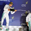 Race winner Nico Rosberg (GER) Mercedes AMG F1 and Lewis Hamilton (GBR) Mercedes AMG F1 celebrate on the podium at Formula One World Championship, Rd2, Bahrain Grand Prix Race, Bahrain International Circuit, Sakhir, Bahrain, Sunday 3 April 2016. © Sutton Motorsport Images