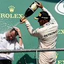 Hywel Thomas (GBR) Mercedes AMG F1 and Lewis Hamilton (GBR) Mercedes AMG F1 celebrate on the podium with the champagne at Formula One World Championship, Rd13, Belgian Grand Prix, Race, Spa Francorchamps, Belgium, Sunday 28 August 2016. © Sutton Images