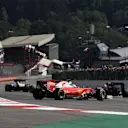 Sebastian Vettel (GER) Ferrari SF16-H and Kimi Raikkonen (FIN) Ferrari SF16-H collide at the start of the race at Formula One World Championship, Rd13, Belgian Grand Prix, Race, Spa Francorchamps, Belgium, Sunday 28 August 2016. © Sutton Images