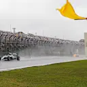Nico Rosberg (GER) Mercedes-Benz F1 W07 Hybrid and marshal with yellow flag at Formula One World Championship, Rd20, Brazilian Grand Prix, Race, Interlagos, Sao Paulo, Brazil, Sunday 13 November 2016. © Sutton Images