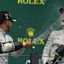 Race winner Lewis Hamilton (GBR) Mercedes AMG F1 and Nico Rosberg (GER) Mercedes AMG F1 celebrate on the podium with the champagne at Formula One World Championship, Rd20, Brazilian Grand Prix, Race, Interlagos, Sao Paulo, Brazil, Sunday 13 November 2016. © Sutton Images