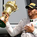 Race winner Lewis Hamilton (GBR) Mercedes AMG F1 celebrates on the podium with the trophy at Formula One World Championship, Rd10, British Grand Prix, Race, Silverstone, England, Sunday 10 July 2016. © Sutton Images