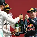 Race winner Lewis Hamilton (GBR) Mercedes AMG F1, Nico Rosberg (GER) Mercedes AMG F1 and Max Verstappen (NED) Red Bull Racing celebrate on the podium with the champagne at Formula One World Championship, Rd10, British Grand Prix, Race, Silverstone, England, Sunday 10 July 2016. © Sutton Images