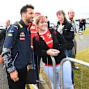Daniel Ricciardo (AUS) Red Bull Racing poses for a photograph with a fan at Formula One World Championship, Rd10, British Grand Prix, Race, Silverstone, England, Sunday 10 July 2016. © Sutton Images