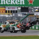 The crashed car of Carlos Sainz jr (ESP) Scuderia Toro Rosso STR11 is recovered at Formula One World Championship, Rd7, Canadian Grand Prix, Qualifying, Montreal, Canada, Saturday 11 June 2016. © Sutton Images