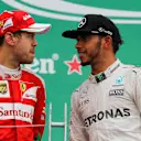 Sebastian Vettel (GER) Ferrari and race winner Lewis Hamilton (GBR) Mercedes AMG F1 celebrate on the podium at Formula One World Championship, Rd7, Canadian Grand Prix, Race, Montreal, Canada, Sunday 12 June 2016. © Sutton Images
