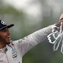 Race winner Lewis Hamilton (GBR) Mercedes AMG F1 celebrates on the podium with the trophy at Formula One World Championship, Rd7, Canadian Grand Prix, Race, Montreal, Canada, Sunday 12 June 2016. © Sutton Images