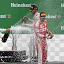 Valtteri Bottas (FIN) Williams, Lewis Hamilton (GBR) Mercedes AMG F1 and Sebastian Vettel (GER) Ferrari celebrate on the podium with the champagne at Formula One World Championship, Rd7, Canadian Grand Prix, Race, Montreal, Canada, Sunday 12 June 2016. © Sutton Images