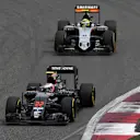 Jenson Button (GBR) McLaren MP4-31 and Sergio Perez (MEX) Force India VJM09 at Formula One World Championship, Rd3, Chinese Grand Prix, Practice, Shanghai, China, Friday 15 April 2016. © Sutton Motorsport Images