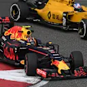 Daniil Kvyat (RUS) Red Bull Racing RB12 with Jolyon Palmer (GBR) Renault Sport F1 Team RS16 battle at Formula One World Championship, Rd3, Chinese Grand Prix, Practice, Shanghai, China, Friday 15 April 2016. © Sutton Motorsport Images