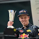 Daniil Kyvat (RUS) Red Bull Racing celebrates on the podium with the trophy at Formula One World Championship, Rd3, Chinese Grand Prix, Race, Shanghai, China, Sunday 17 April 2016. © Sutton Motorsport Images